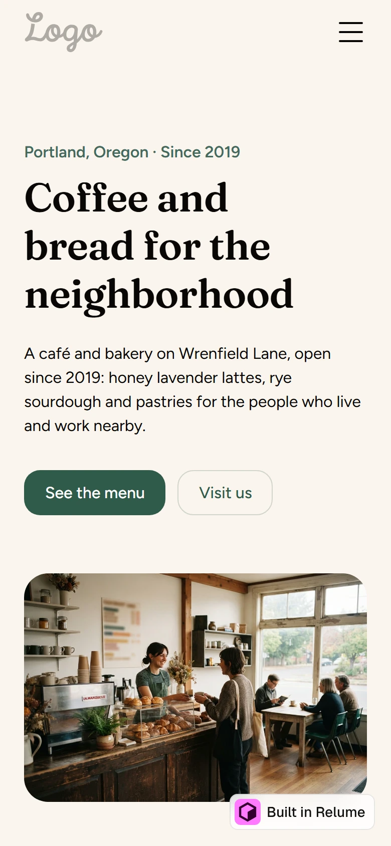 Relume's cafe Home page on a phone with a large serif headline, two buttons and a photo of a cafe counter, and a Built in Relume badge in the corner