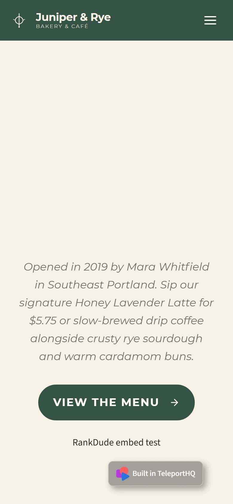 The cafe home page on a phone with a green bar, a large empty cream area where the headline should be, a paragraph, a View the Menu button and a Built in TeleportHQ badge